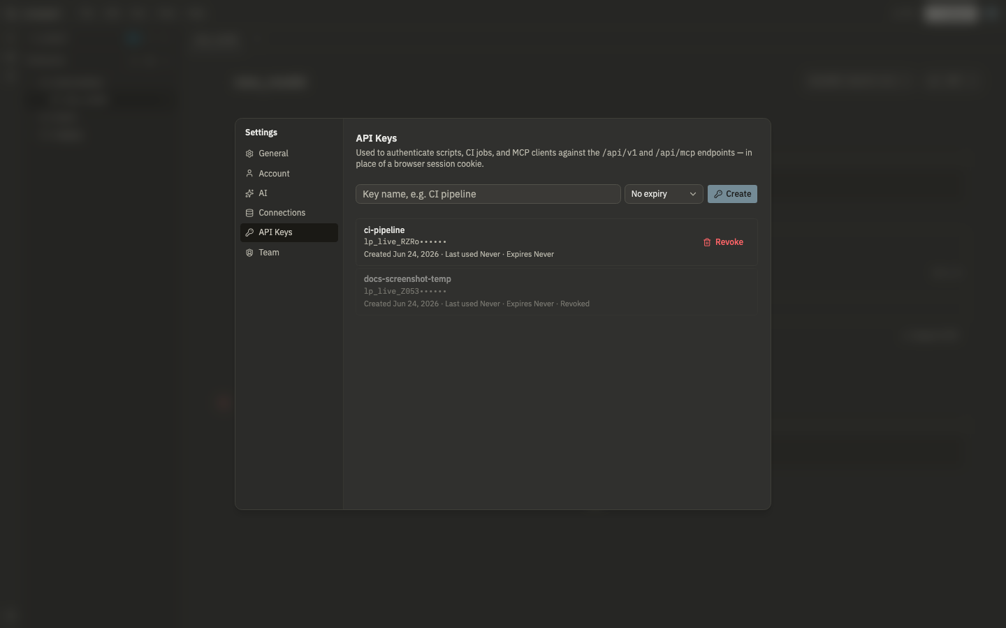 The API Keys settings panel showing a created key, masked, with its creation date and revoke action